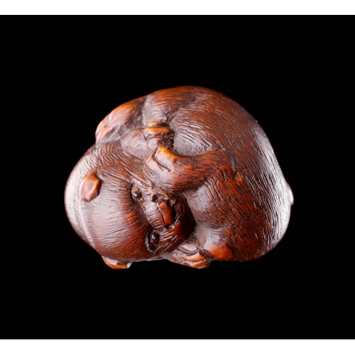 A Finely Carved Wood Netsuke of Two Puppy Dogs Playing